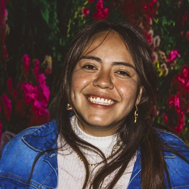 Kaveri Mehta, Lead Design Curator at Trail Whim Lattice, reviewing corporate floral arrangements